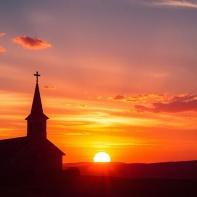 Silhouetted church and sunset landscape for Good Friday service.