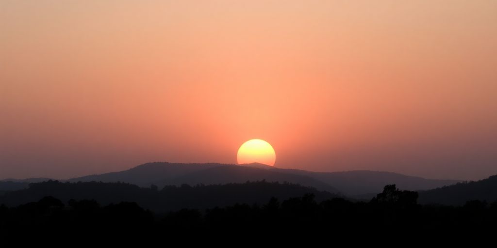 Silhouetted landscape at sunrise symbolizing hope and healing.
