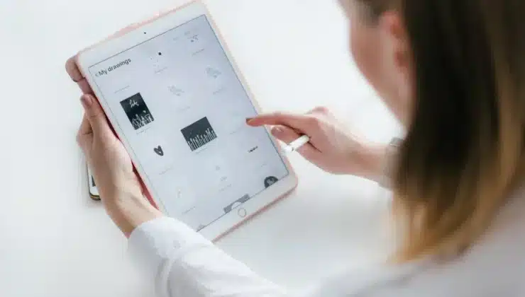Person browsing drawings on tablet